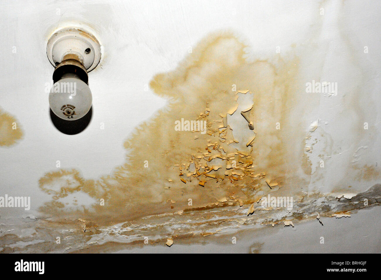 Water Damage On Ceiling Beneath Bathroom Stock Photo