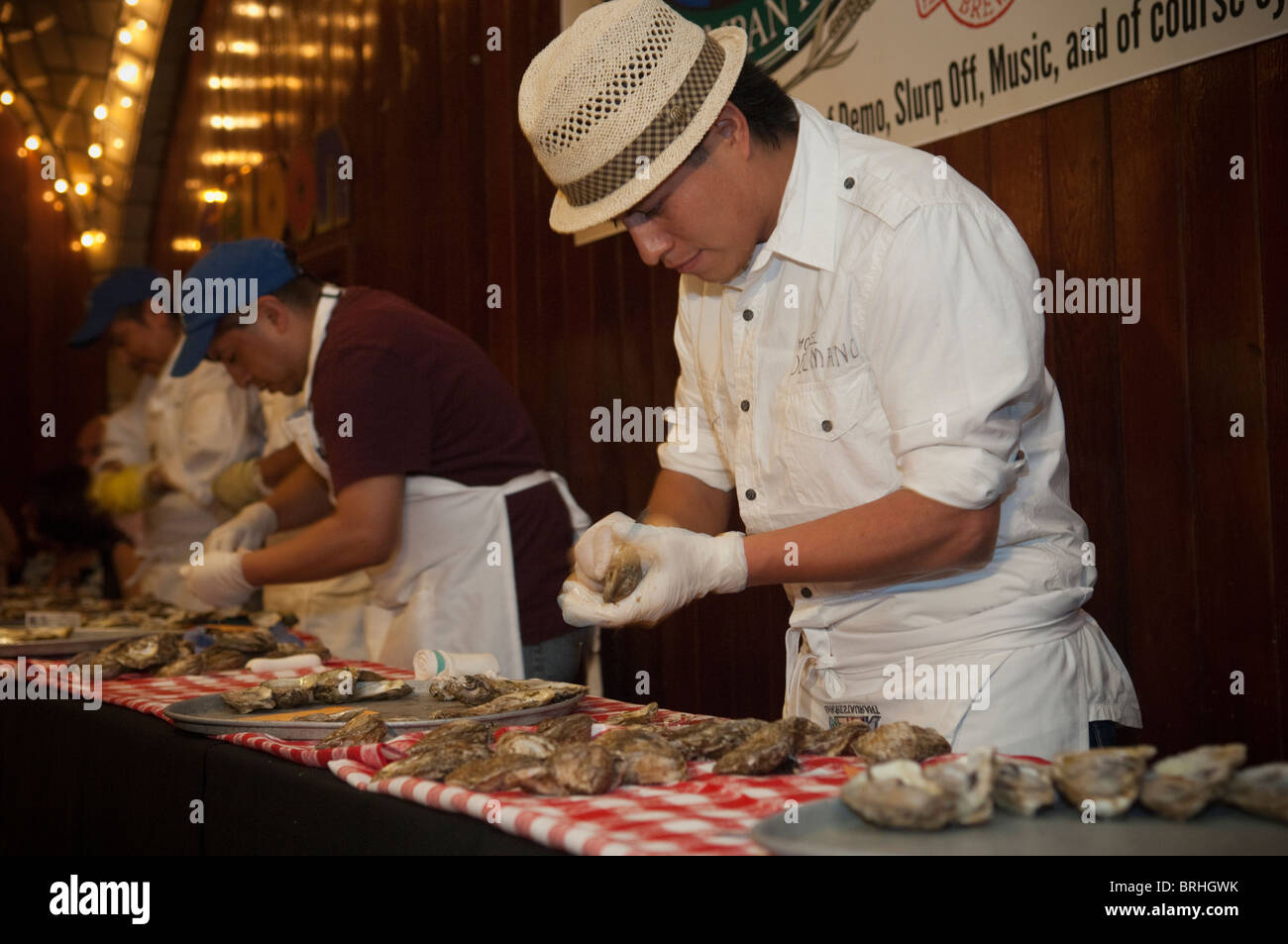Oyster shuckers compete in an oyster shucking competition in the famous