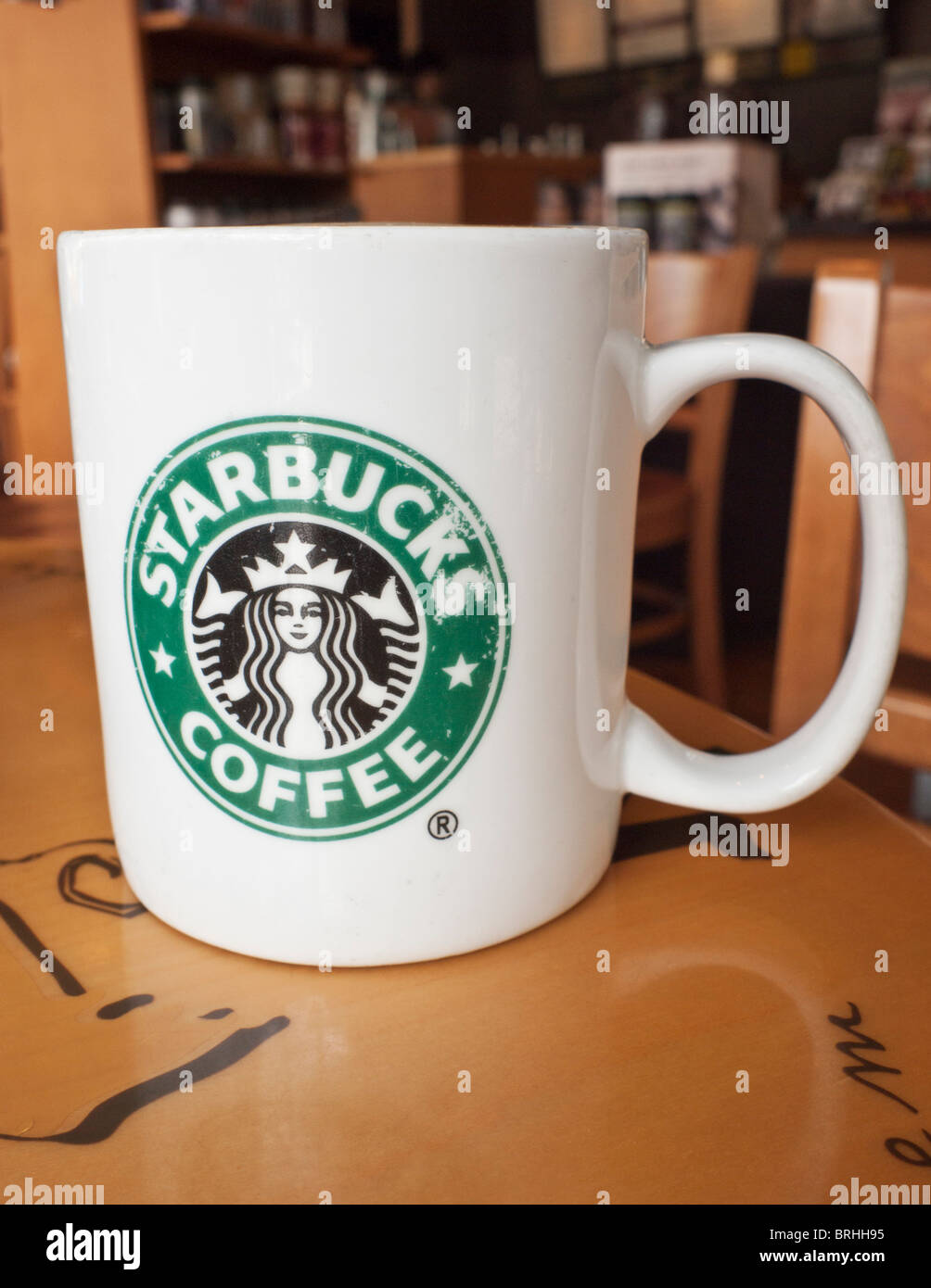 Selective focus on a Starbucks coffee mug in a Starbucks cafe, Singapore Stock Photo