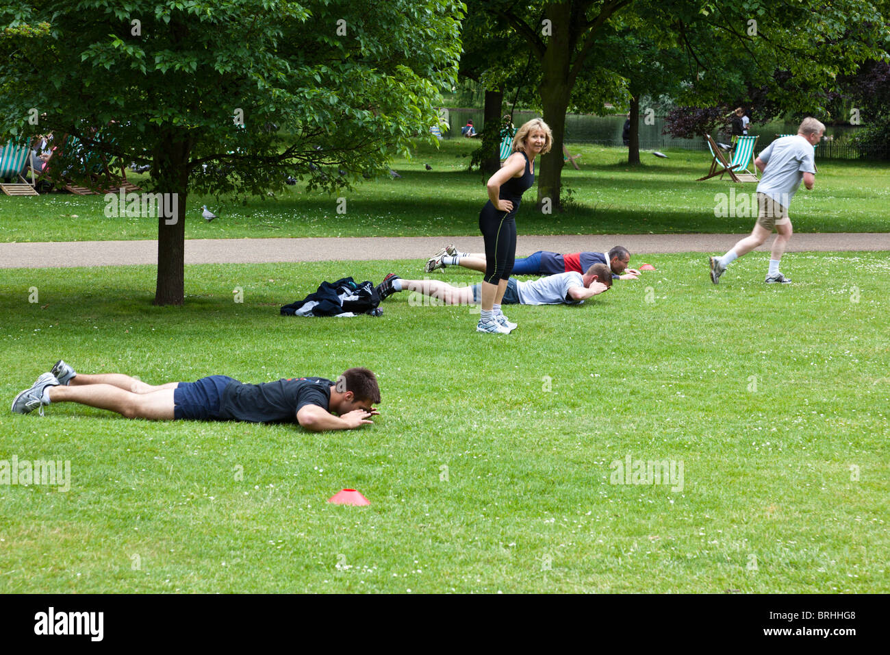 People exercising at lunchtime in St. James Park, London Stock Photo