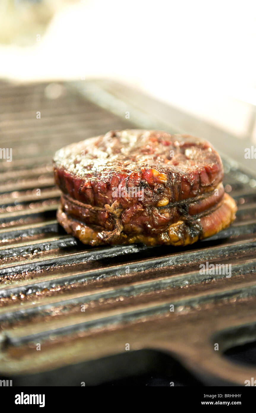 Close up of steak being cooked on griddle pan Stock Photo Alamy