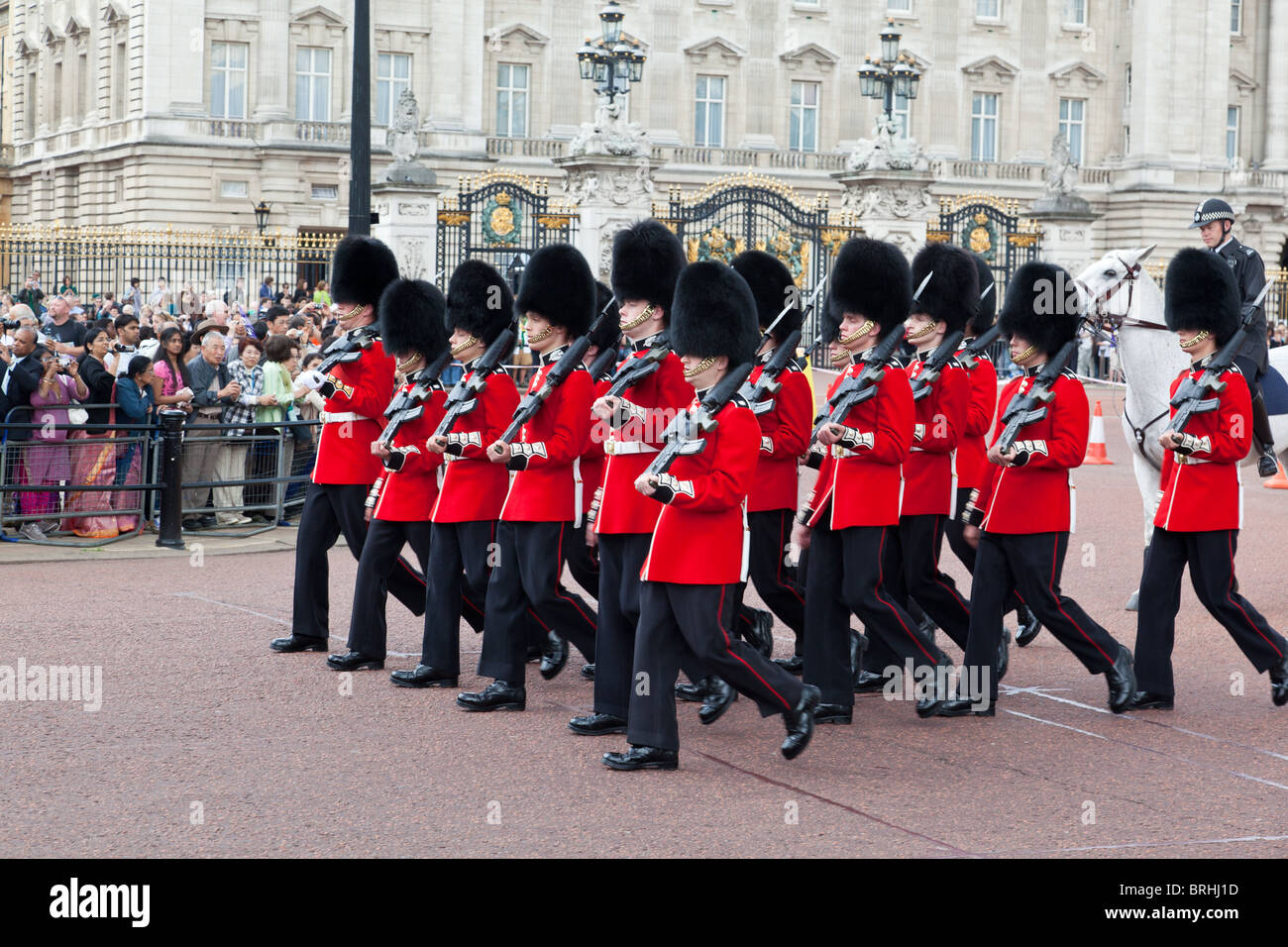 Queen's guardsmen march outside Buckingham Palace during    changing of the guard Stock Photo