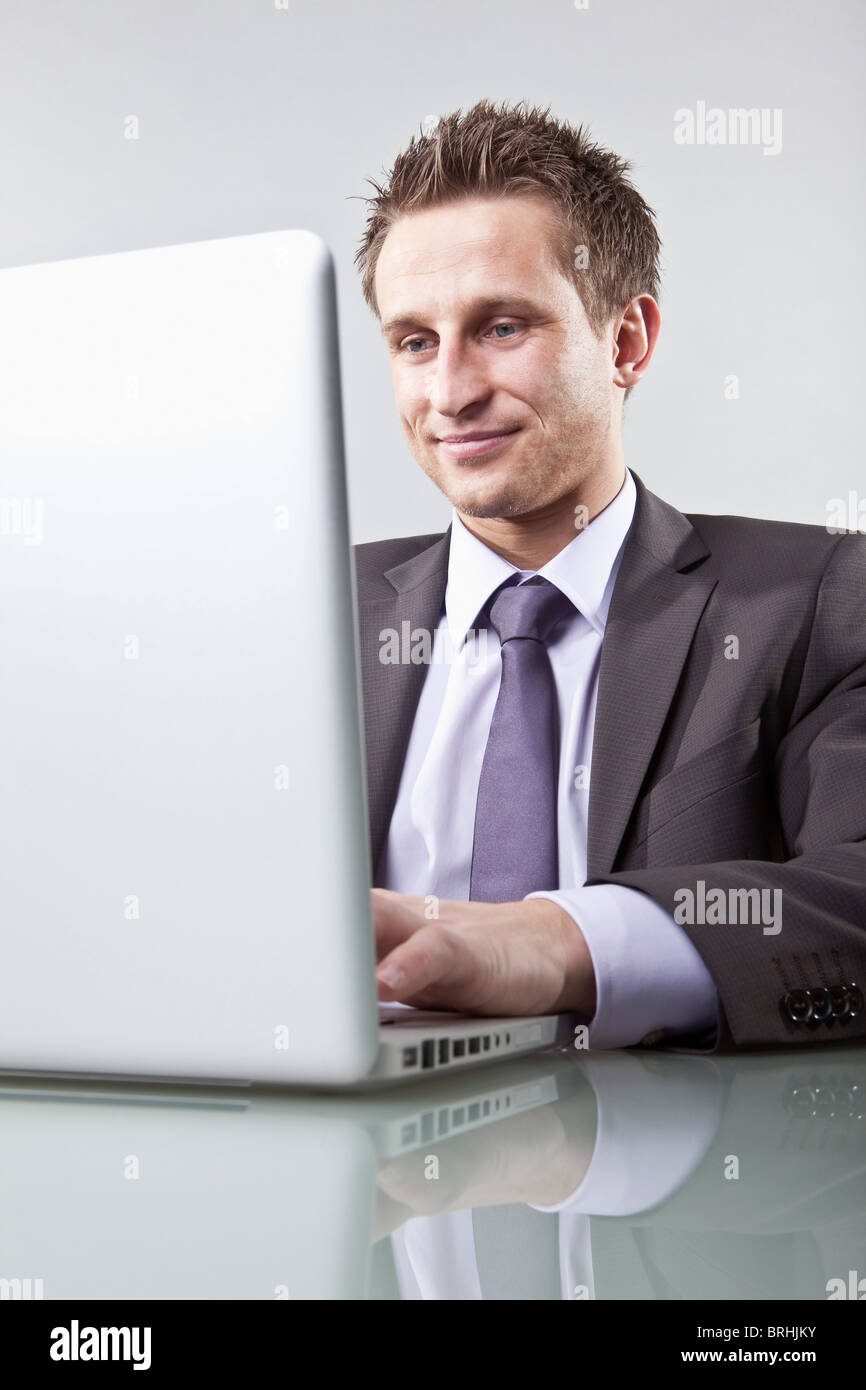 Businessman Using Laptop Computer Stock Photo - Alamy