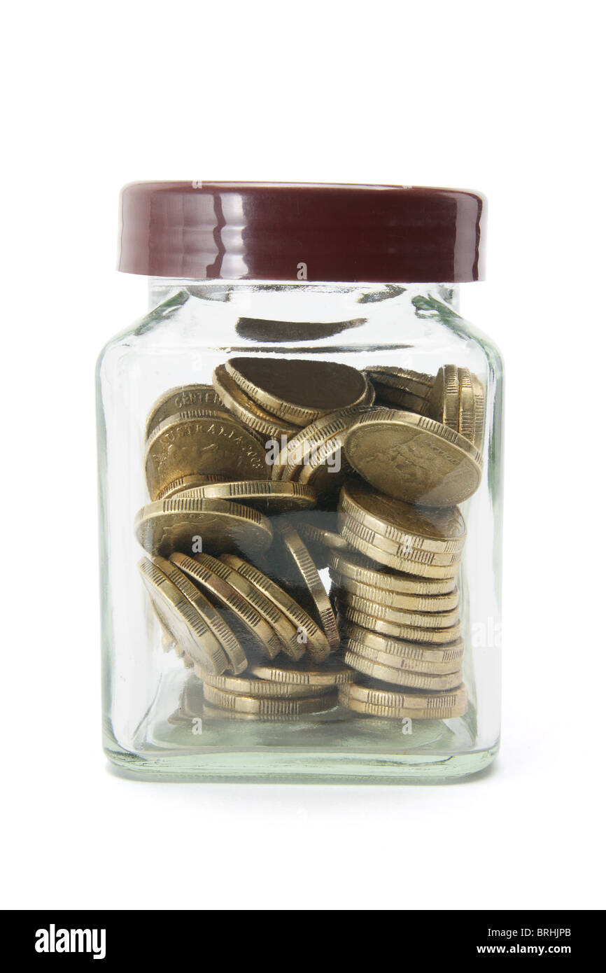 Coins in Glass Jar Stock Photo