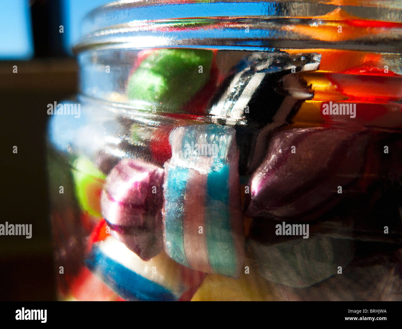 glass jar filled with hard candy Stock Photo Alamy