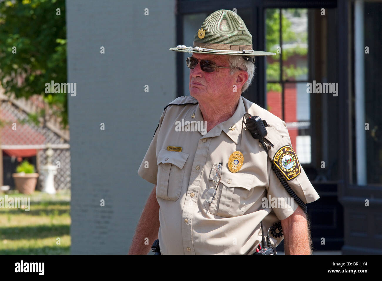 Policeman, police officer, state trooper, sheriff directs traffic in street Stock Photo
