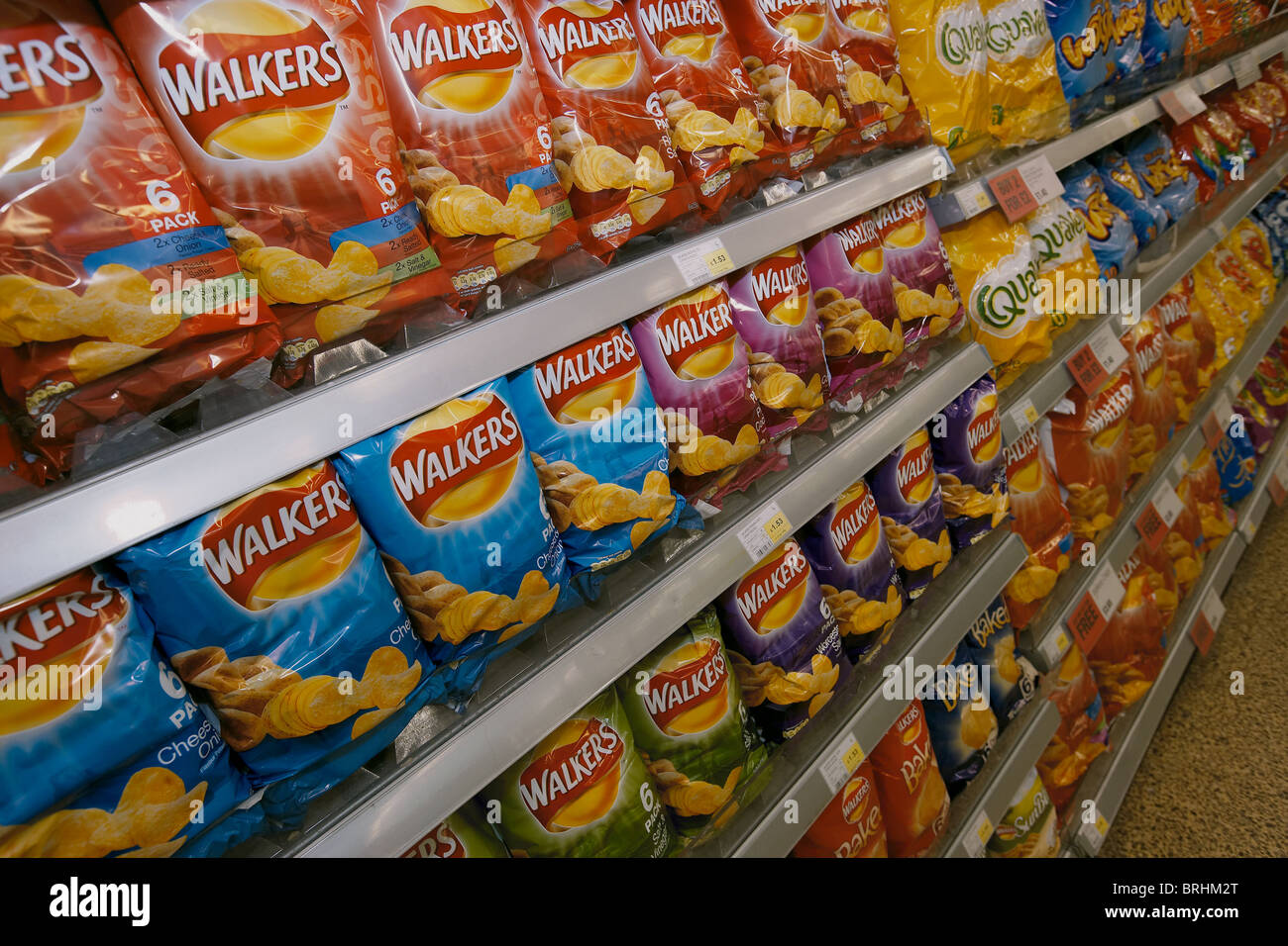 Crisps displayed for sale on a supermarket shelf uk Stock Photo Alamy