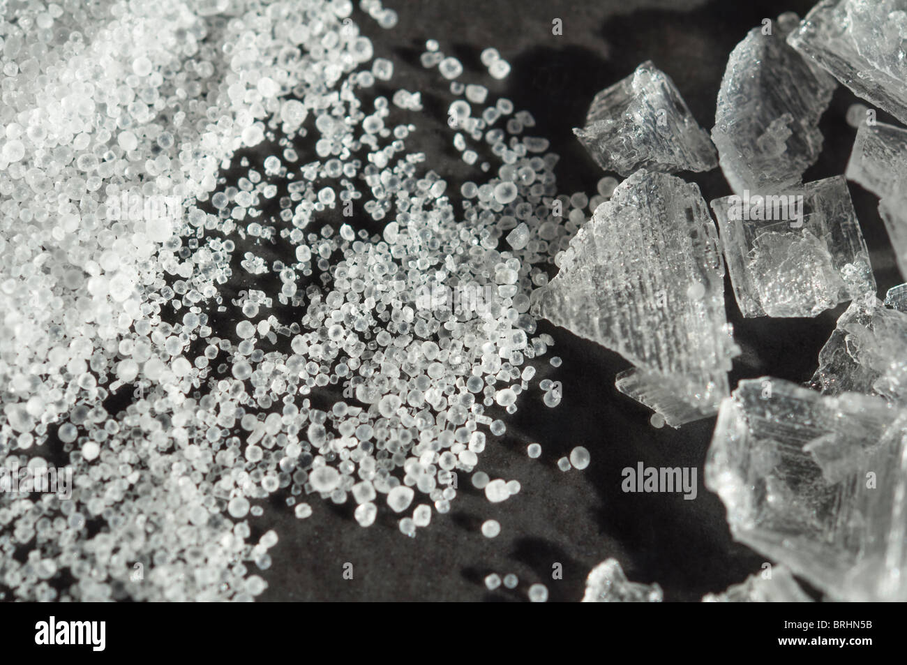 Macro closeup of Table salt rounded grains juxtaposed with crystalized