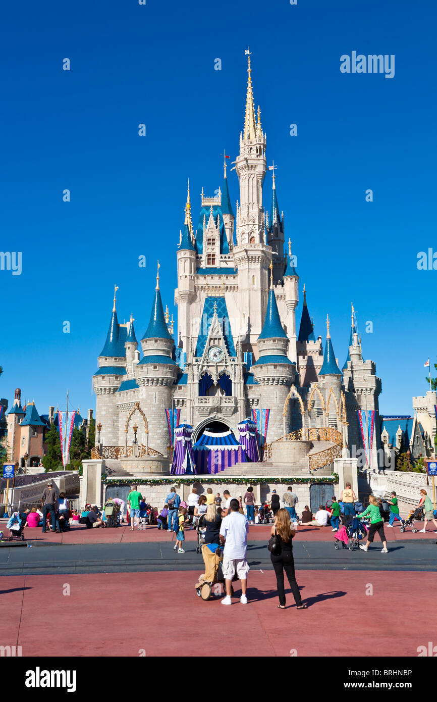 Kissimmee, FL - Nov 2009 - Park guests pose for photos in front of Cinderella's Castle in Walt Disney's Magic Kingdom theme park Stock Photo