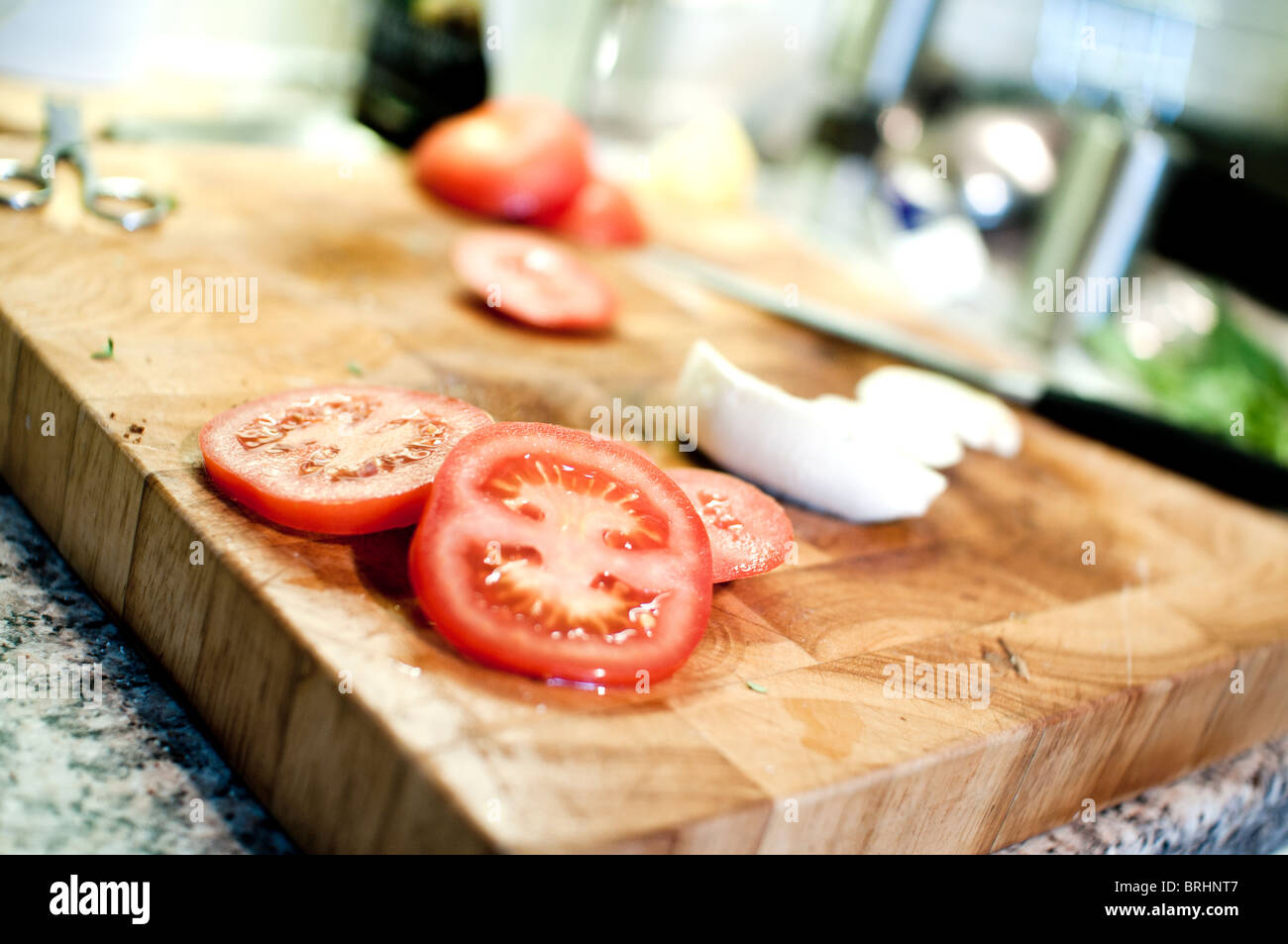 Tomato on the chopping board hi-res stock photography and images - Alamy