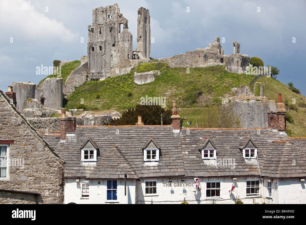 Remnants of Corfe Castle  and village houses Dorset England Stock Photo