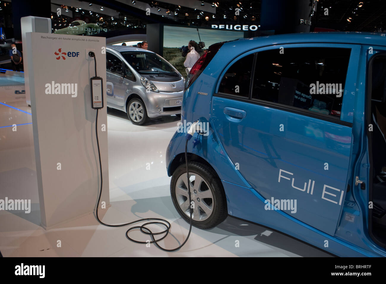 Paris, France, Paris Car Show Electric Cars, for sale, Peugeot, Ion, Charging Cable, sustainable investing, electric charging station france, side view Stock Photo