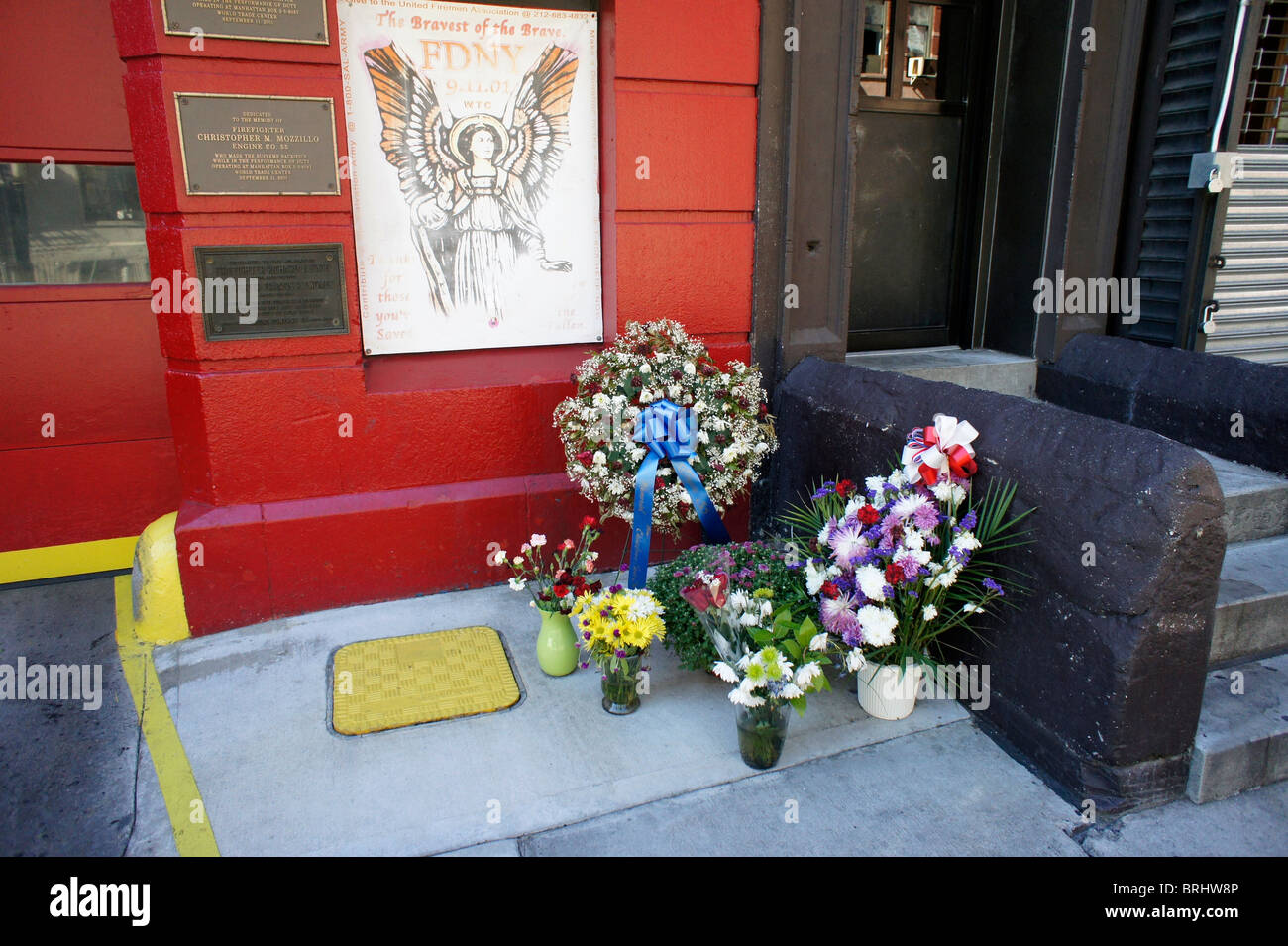 Flowers placed outside a firehouse in downtown Manhattan. Stock Photo