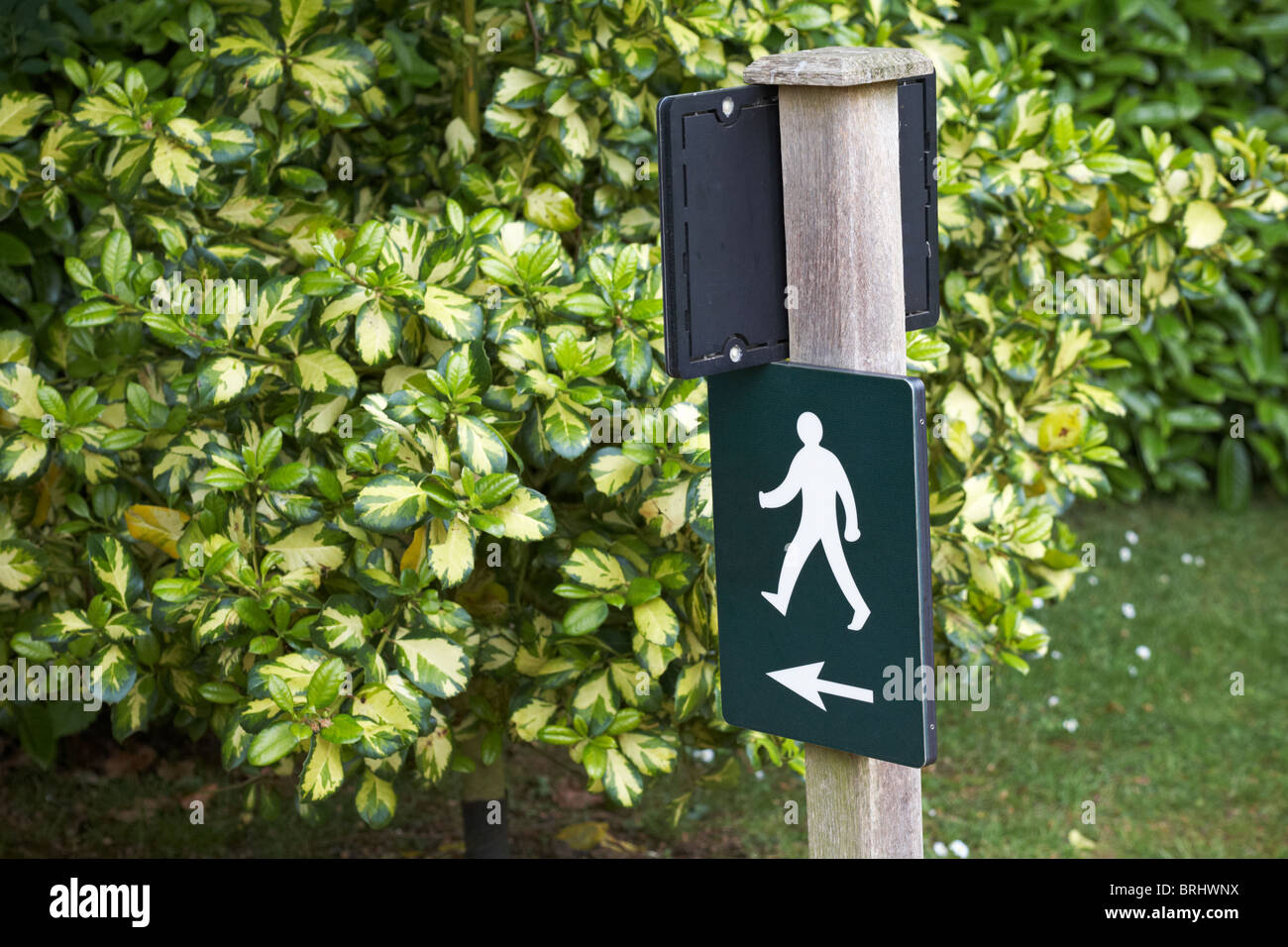Walk this way sign showing man walking in arrow stock photo alamy