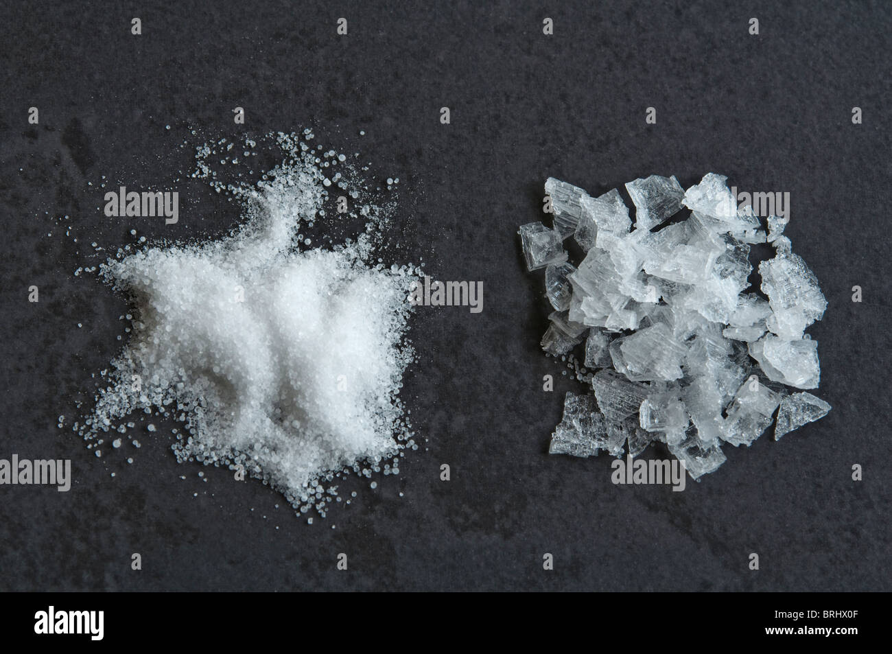Two Salt types small rounded grains of table salt and crystalized sea