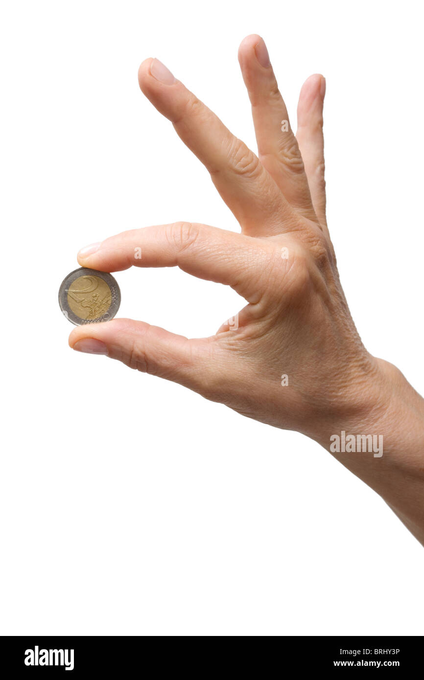 one hand holding a coin Stock Photo