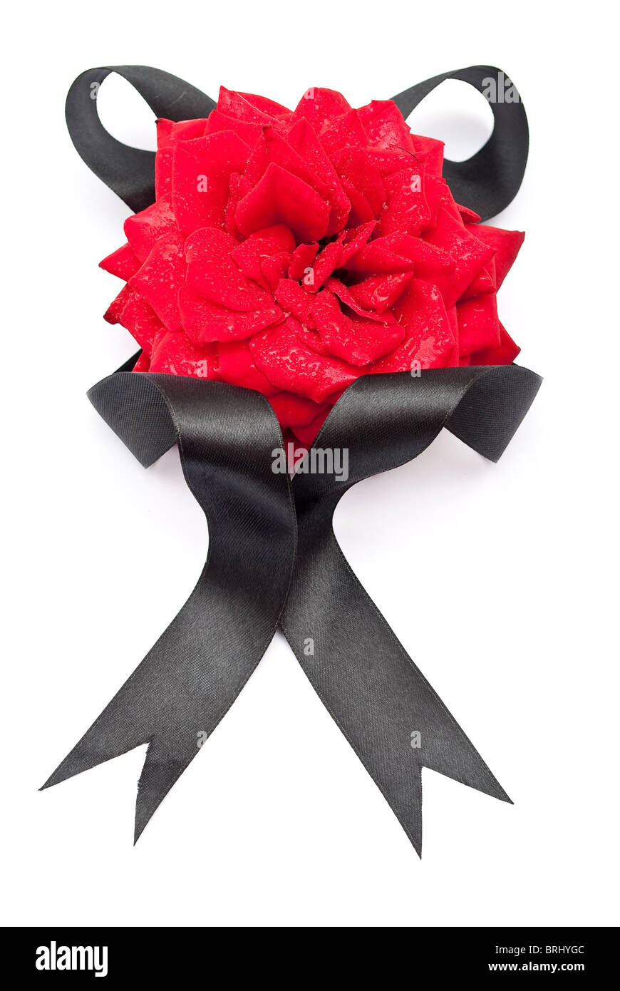 A stylish decoration of red rose flowers, ribbons on a shiny black