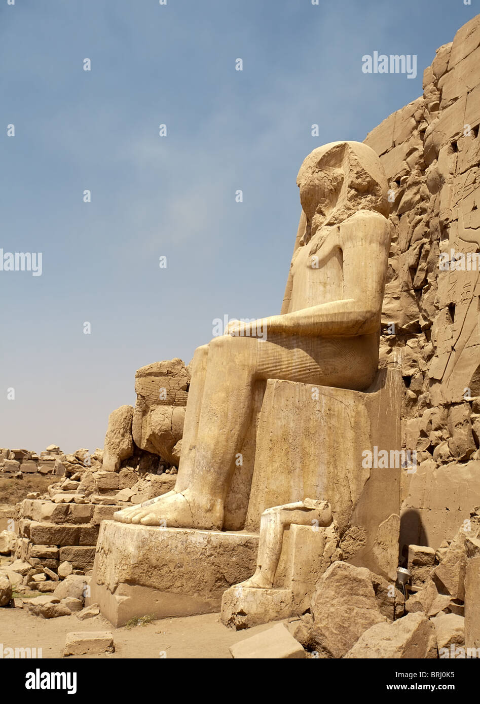 big sitting Egyptian statue in Karnak Temple, Luxor, Egypt Stock Photo