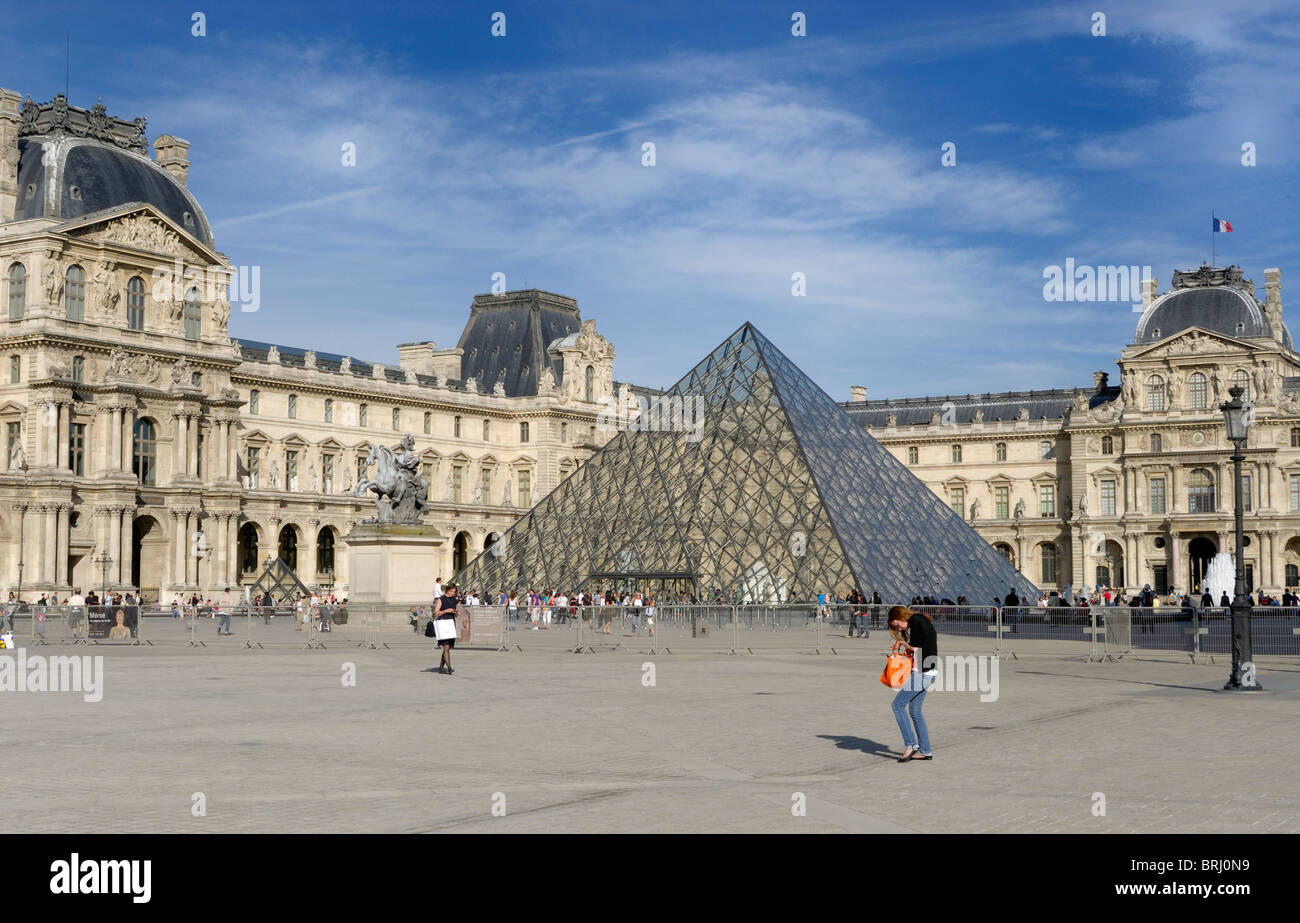 Courtyard of the Palais du Louvre, with Pavillon Richelieu and Sully in background, pyramid in center,  in The city of Paris France. Stock Photo