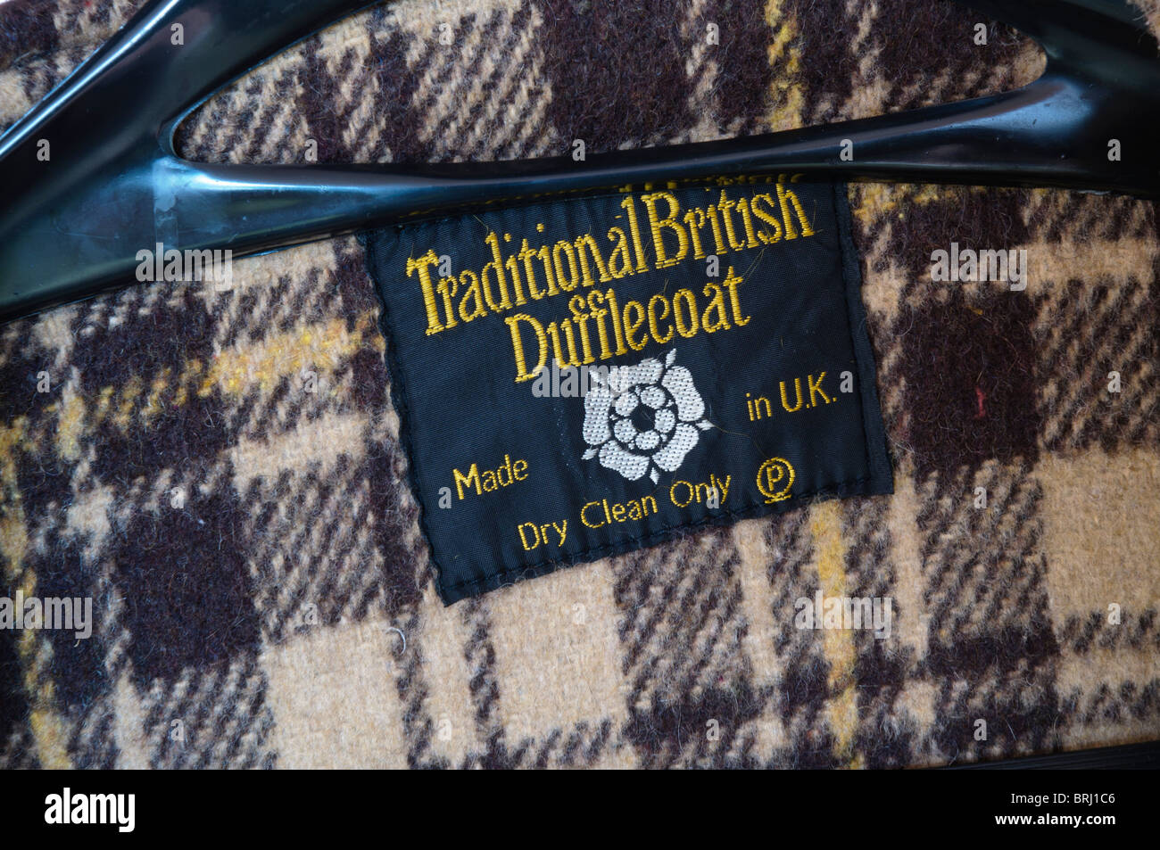 Label of a 'Traditional British Dufflecoat' while hanging on a hanger. Stock Photo