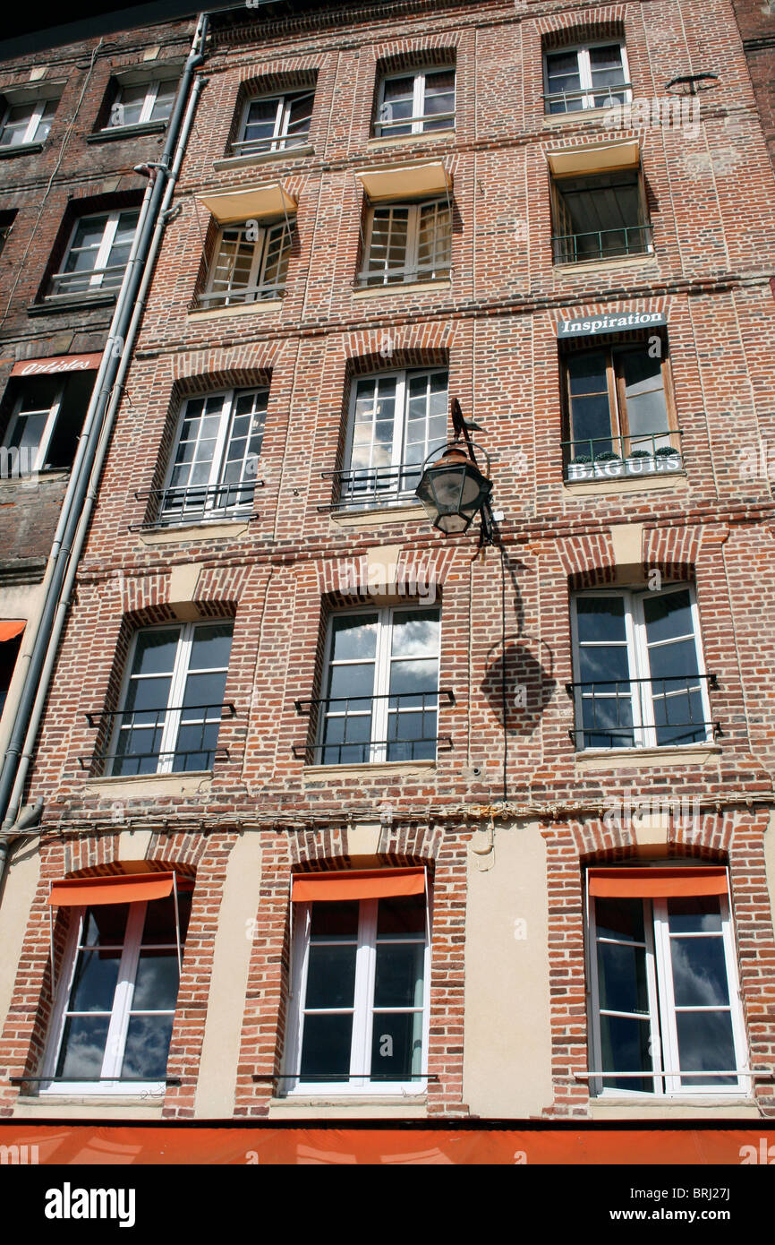 Tall French red brick building Stock Photo