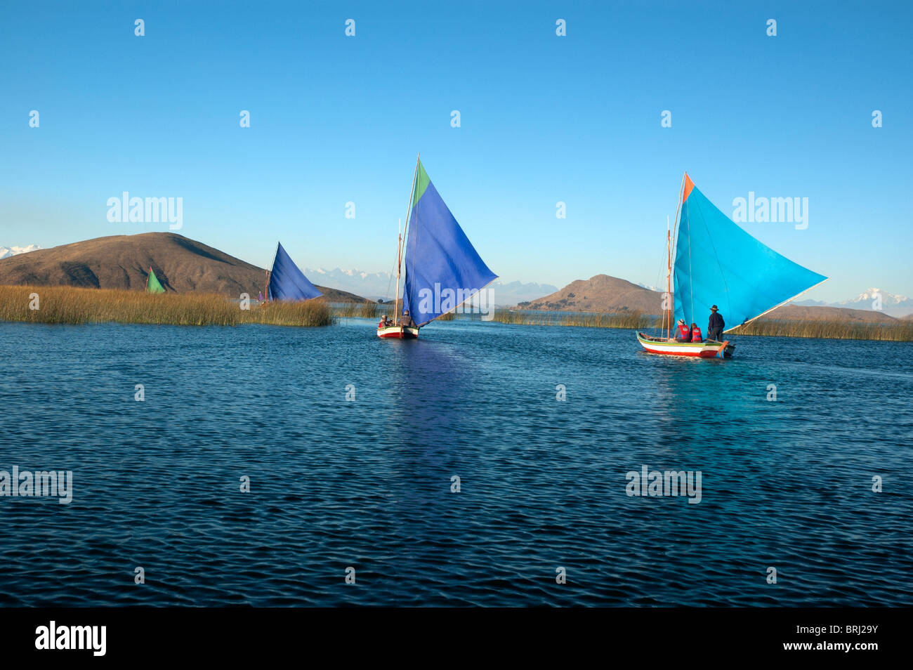 Tourists sailing in small boats to Anapia Island, Lake Titicaca, Peru. Stock Photo