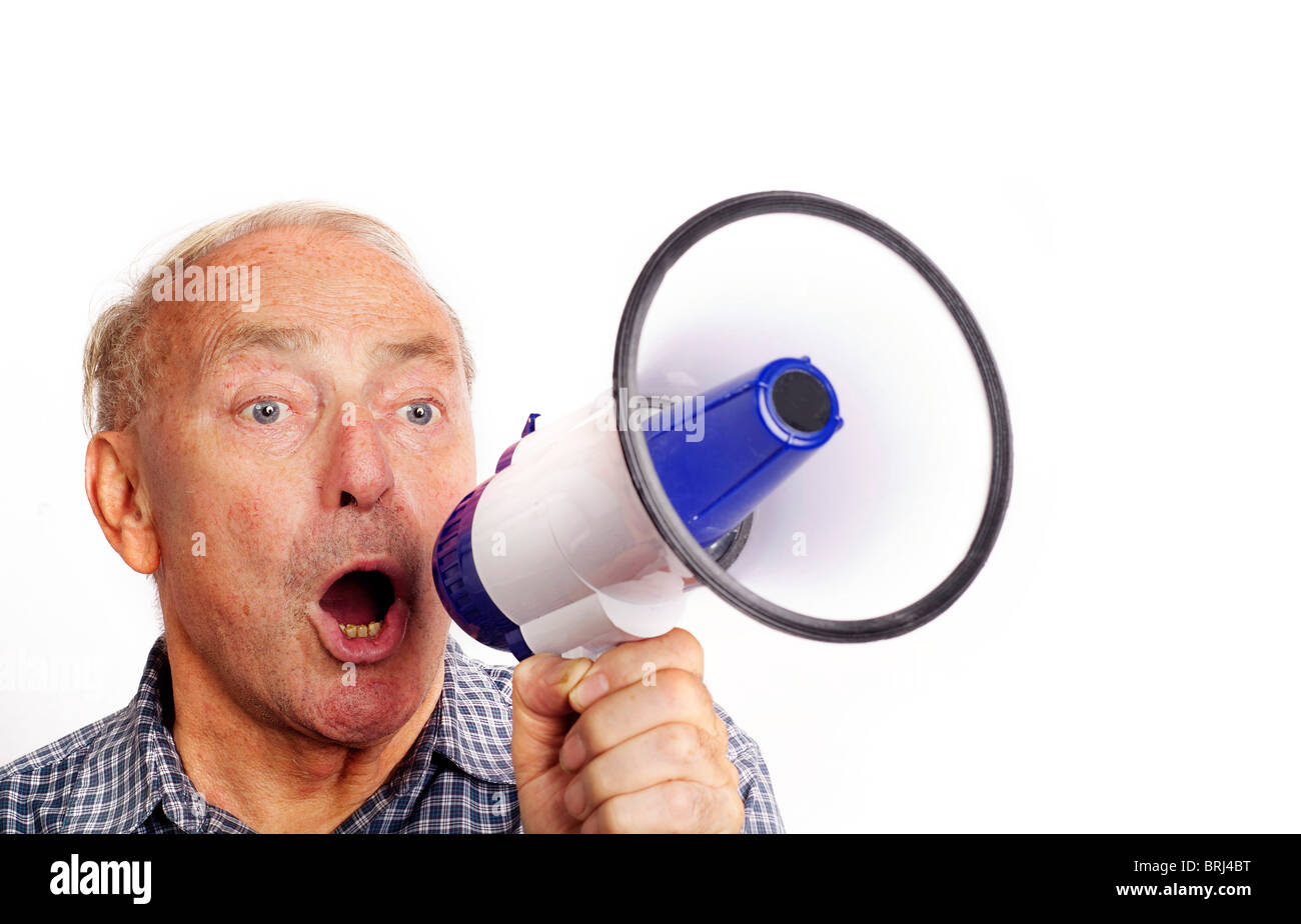Photo of old senior man communicating through bullhorn isolated against white background Stock Photo