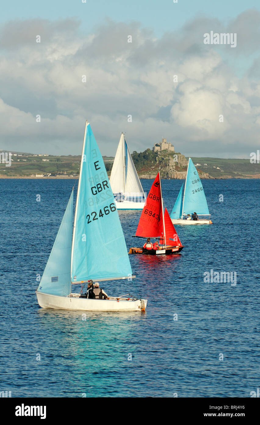 Colourful small sailing boats in front of St. Michael's Mount, Penzance Cornwall UK. Stock Photo