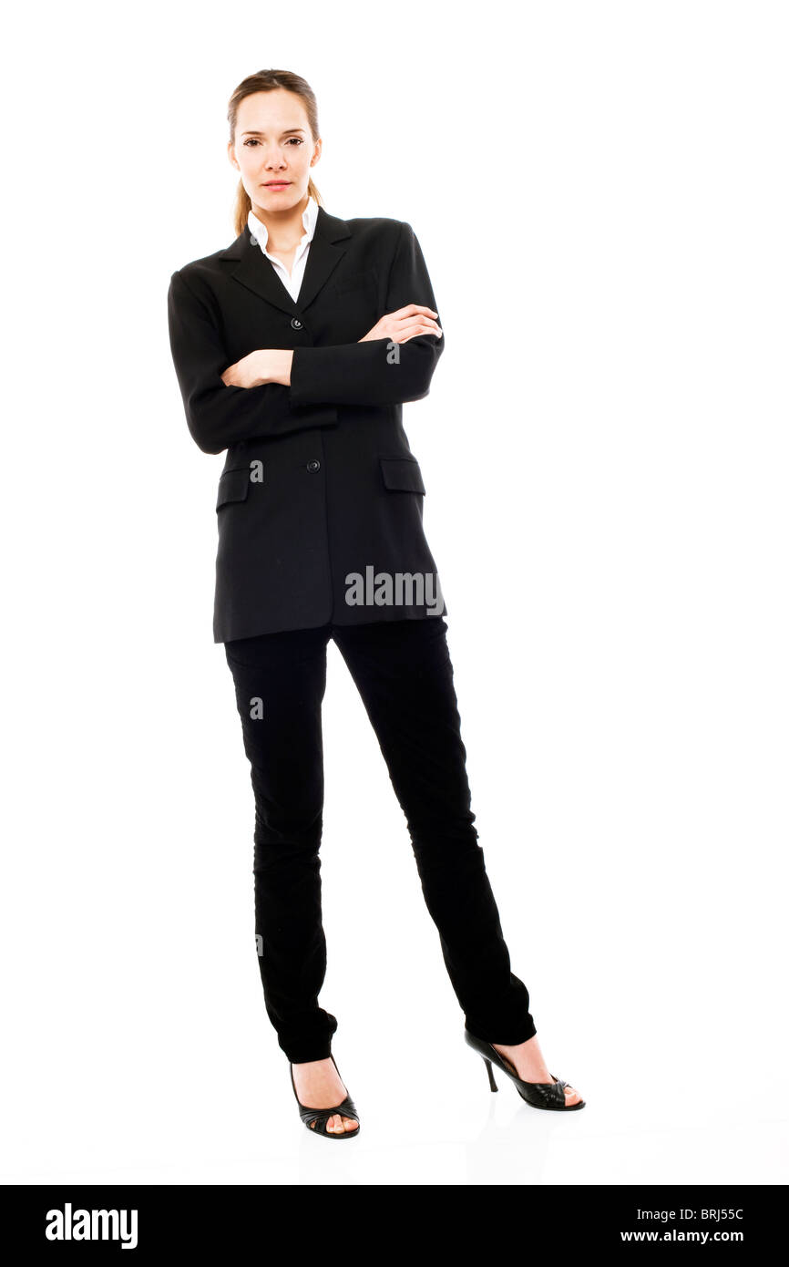 Young businesswoman standing with arms crossed Stock Photo