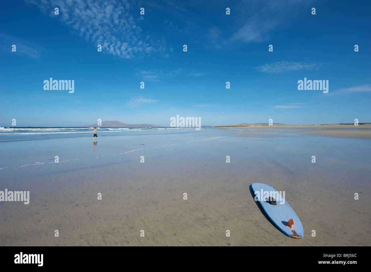 A surfboard on the beach at Carrowniskey, Co. Mayo, Ireland Stock Photo