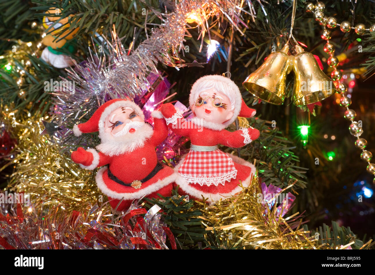 Mr. and Mrs. Santa Claus figures on a Christmas tree Stock Photo