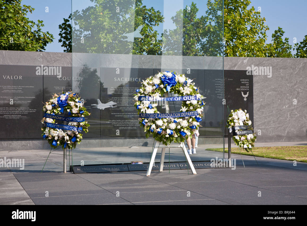 Wreaths of flowers stand in front of memorial wall in memory of fallen Air Force servicemen at the Air Force Memorial Stock Photo