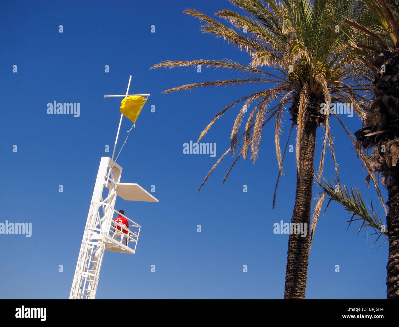 A coast guard tower on the beach in the Spanish seaside town of Javea Stock Photo