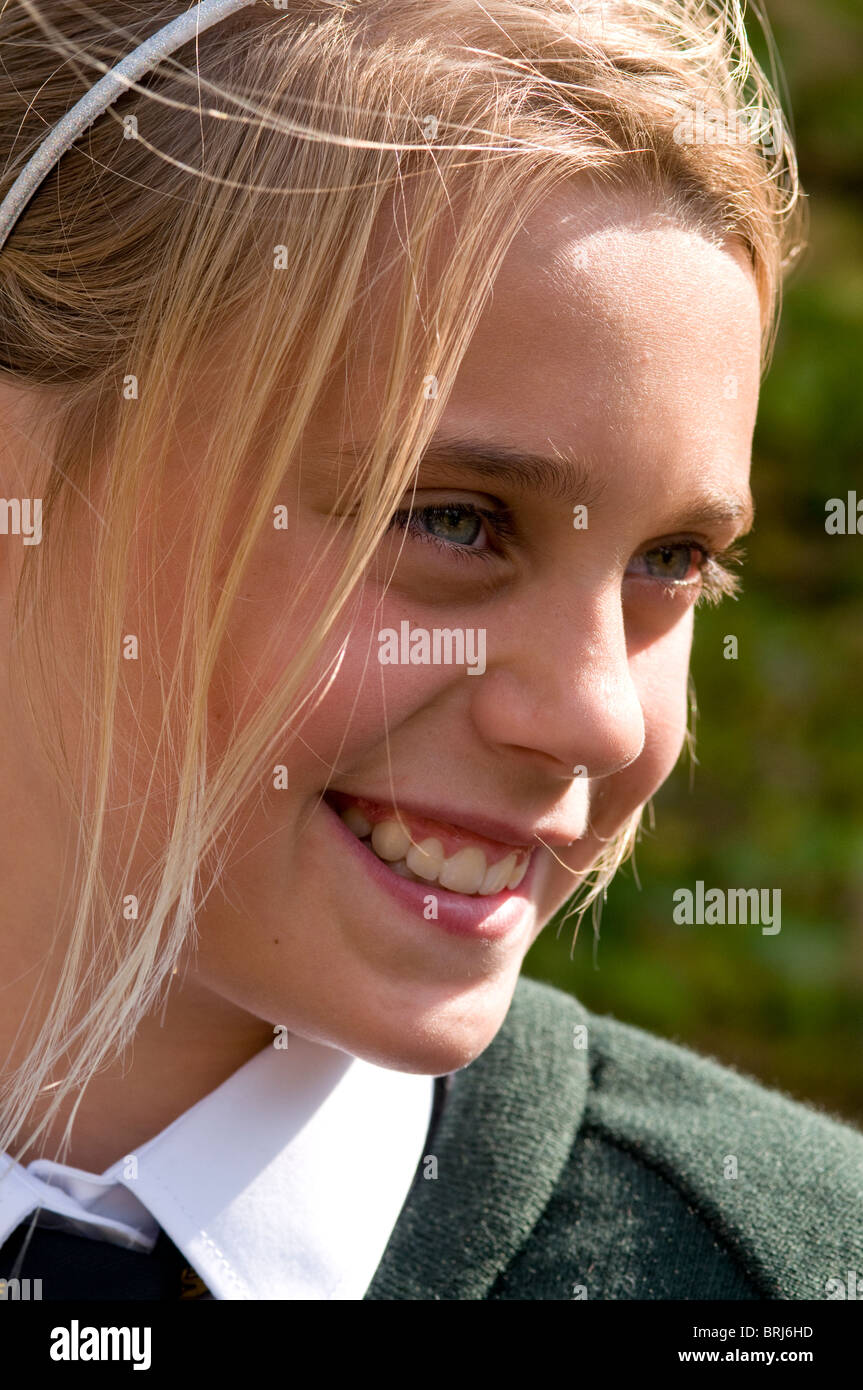Profile of a smiling schoolgirl Stock Photo - Alamy