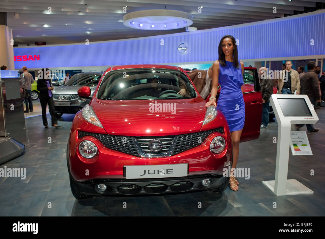 Paris, France, Paris Car Show Hostess, Posing along Nissan 'Juke' Diesel engine, Showroom, front Stock Photo