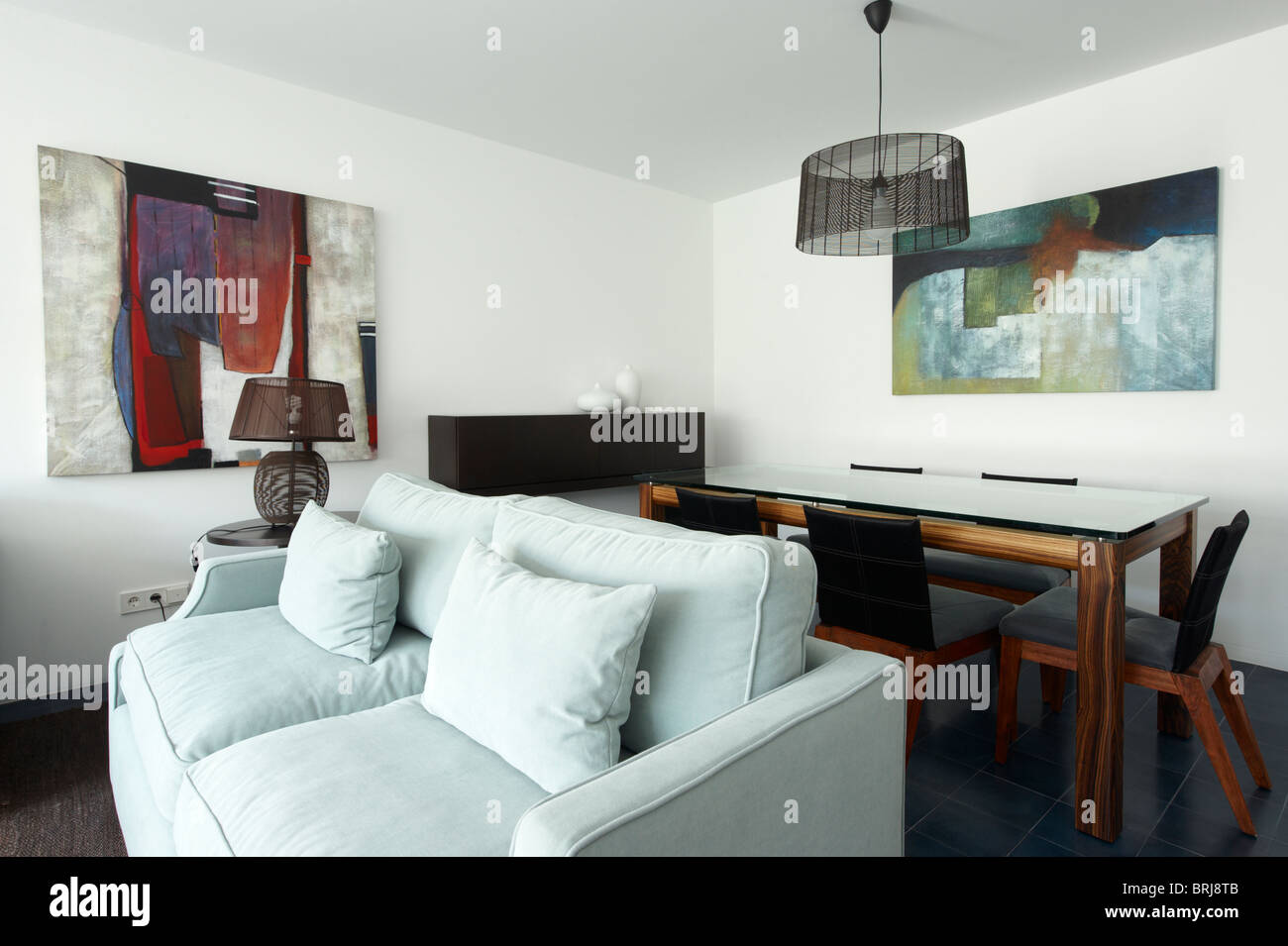 Sofa And Dining Room Table And Chairs In A Modern And