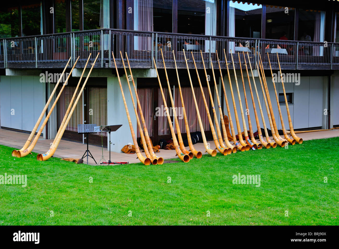 Alphorns lined up outside a Swiss restaurant whilst the players have lunch Stock Photo