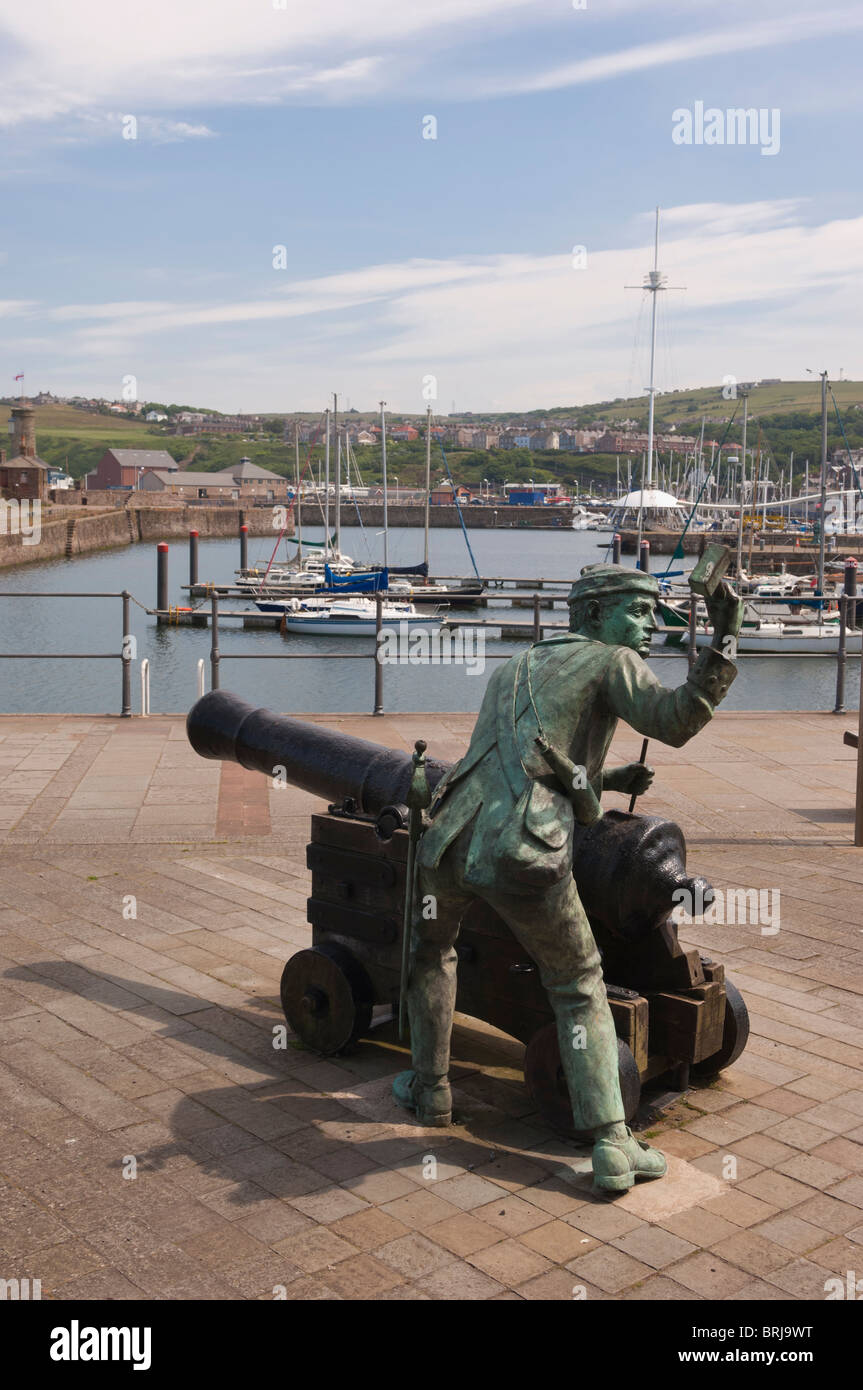 Statue sculpture of a man with a canon at Whitehaven marina and harbour on the west coast of Cumbria , England , Uk Stock Photo