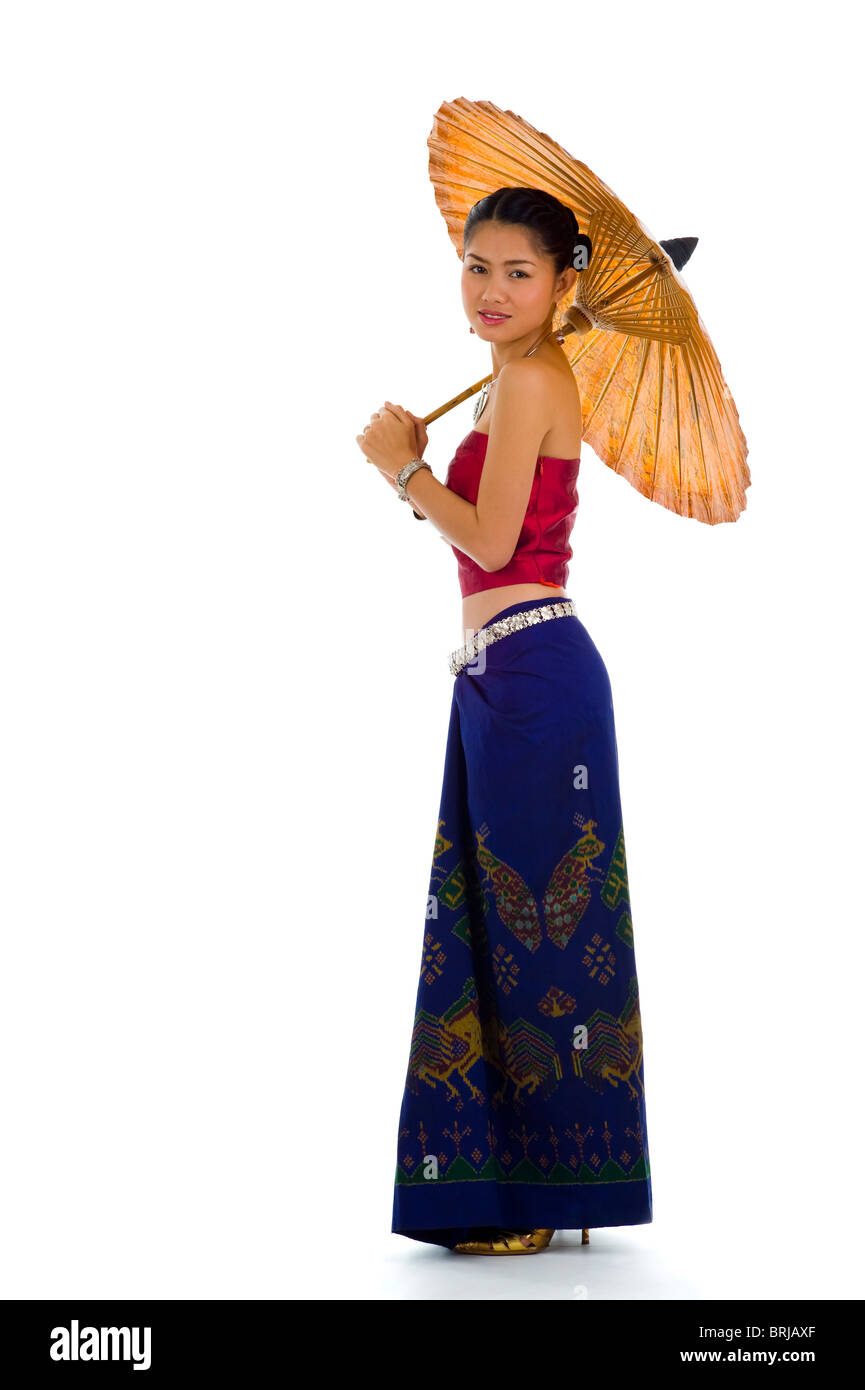 thai girl in traditional isaan style clothes with umbrella, isolated on white Stock Photo