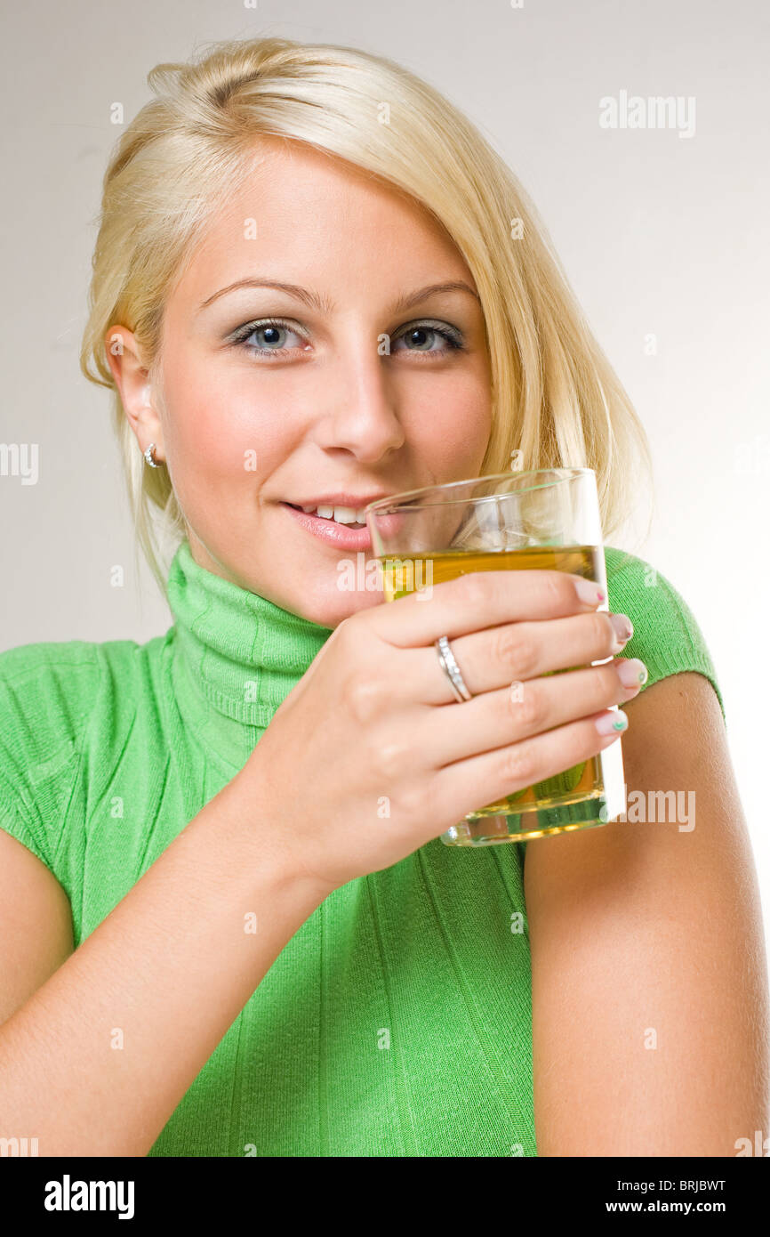 Cute young blond with apple juice Stock Photo Alamy