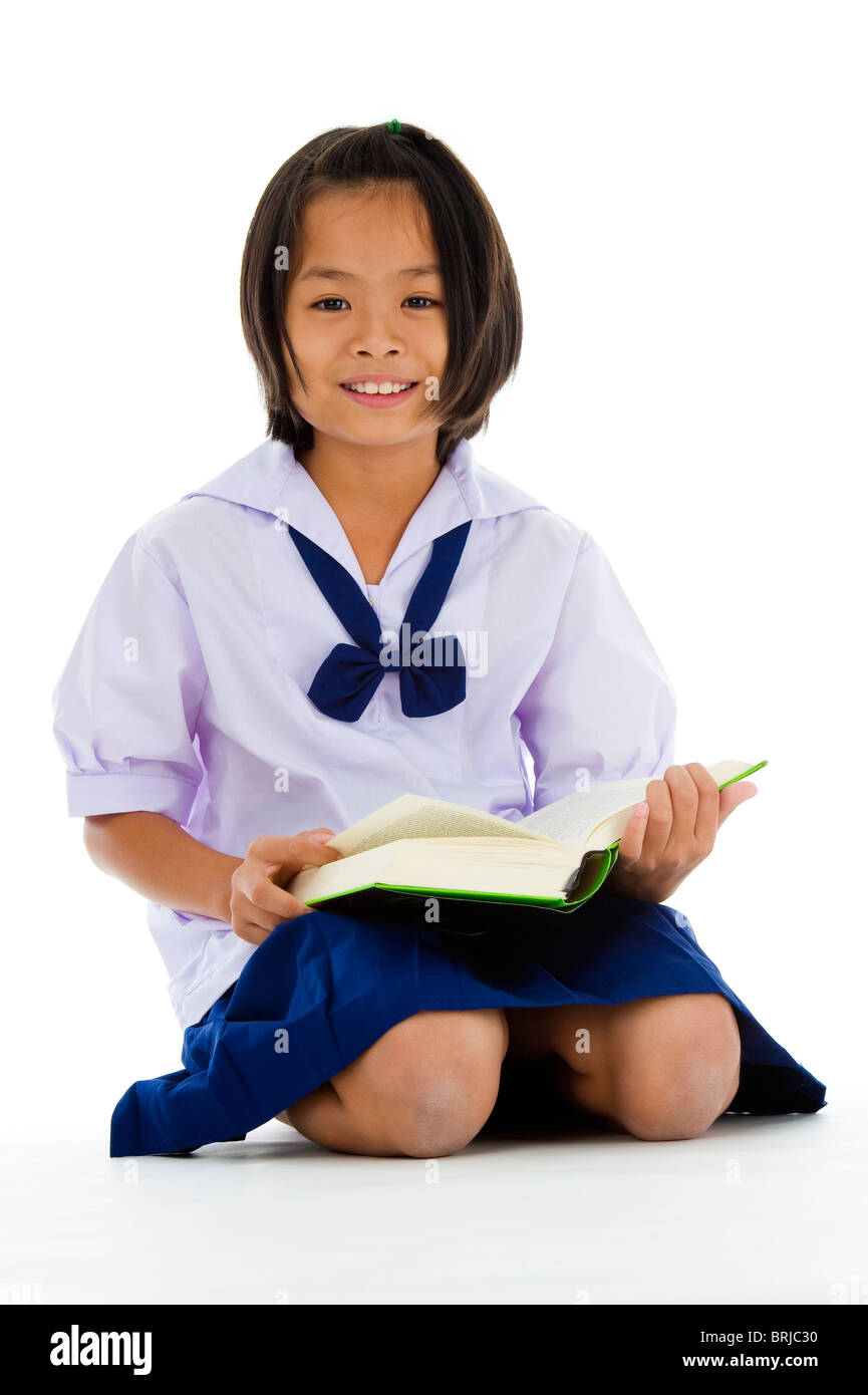cute asian schoolgirl with book, isolated on white background Stock Photo