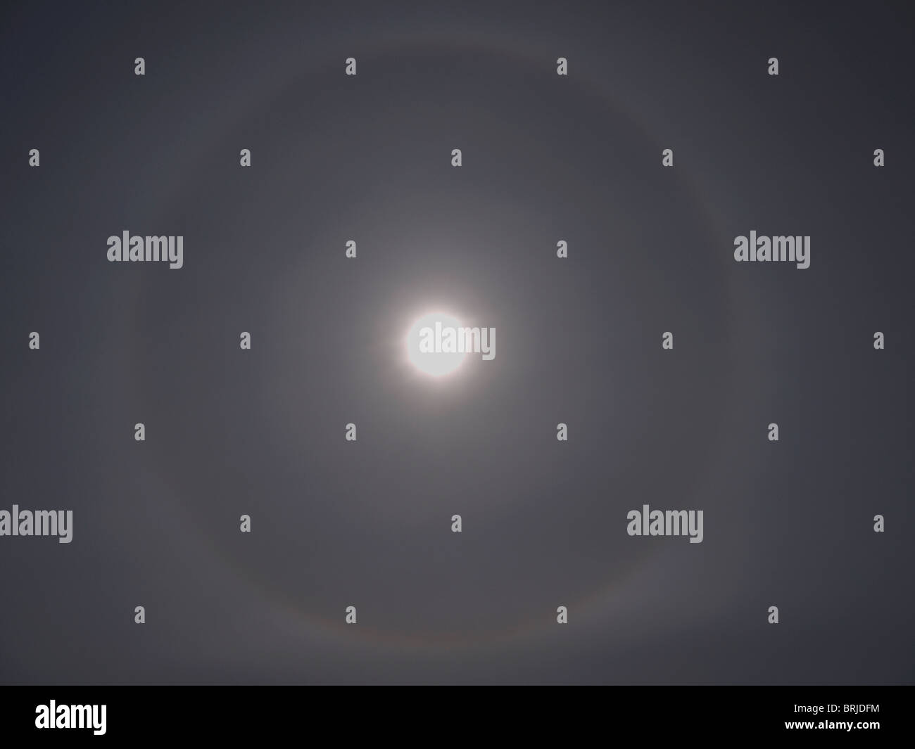 A halo formed around the sun through cirrostratus cloud Stock Photo