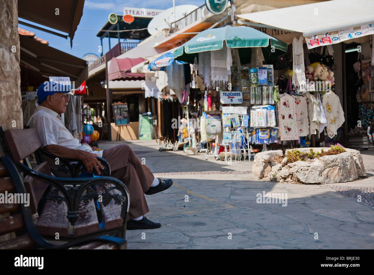 Old man on bench in Polis Cyprus Stock Photo - Alamy