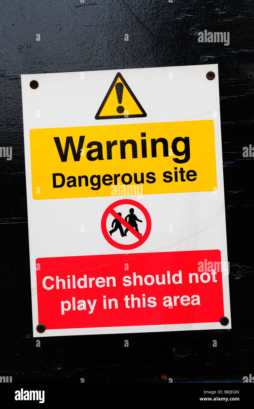 Warning Dangerous Site Children Should Not Play in This Area sign notice, London, England, UK Stock Photo