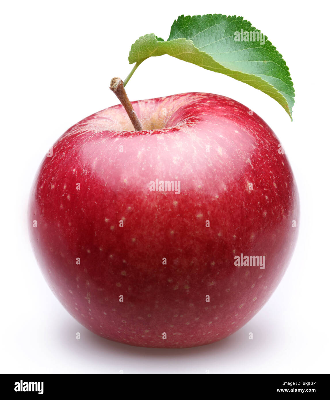 Ripe red apple with a leaf. Isolated on a white background. Stock Photo