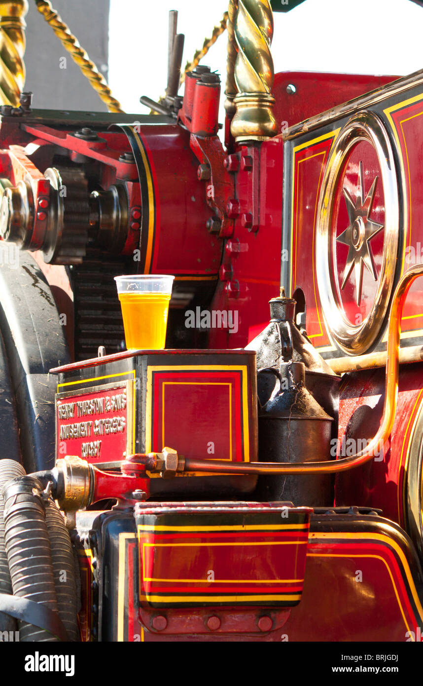 pint of beer on part of a red traction engine Stock Photo