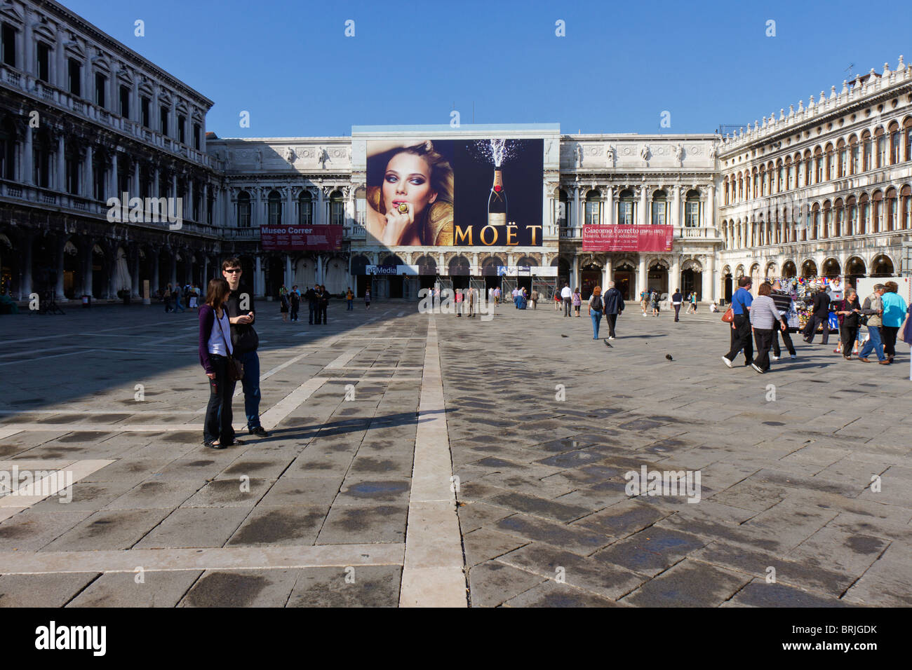 St Mark's Square Venice with large advertisement for champagne, the sponsors of restoration work behind the advert Stock Photo