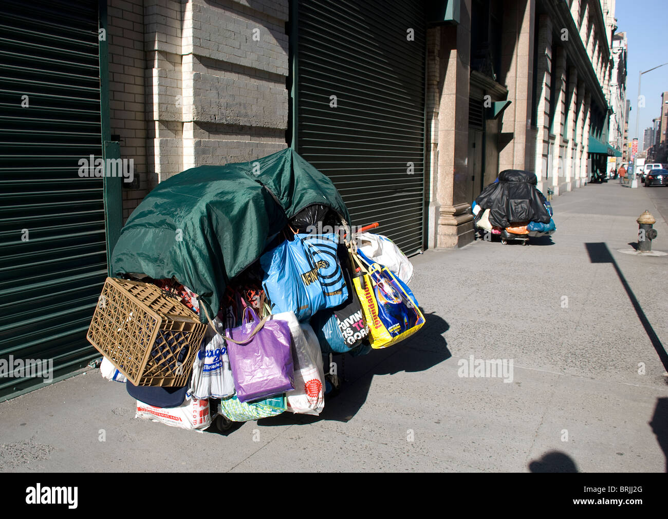 Shopping carts full of possessions belonging to street dweller Stock Photo