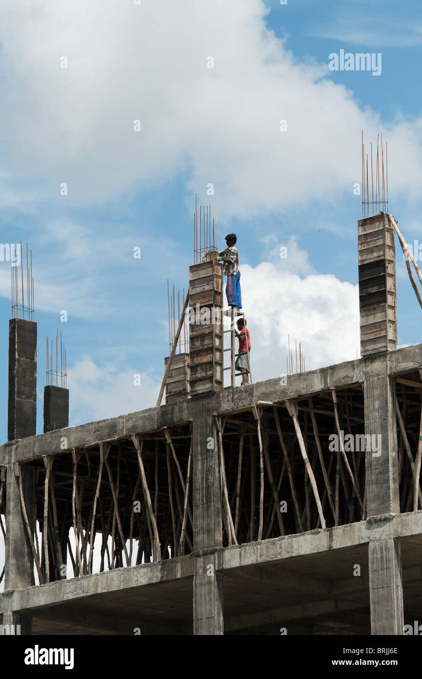 Indian builders constructing concrete apartments. Puttaparthi, Andhra