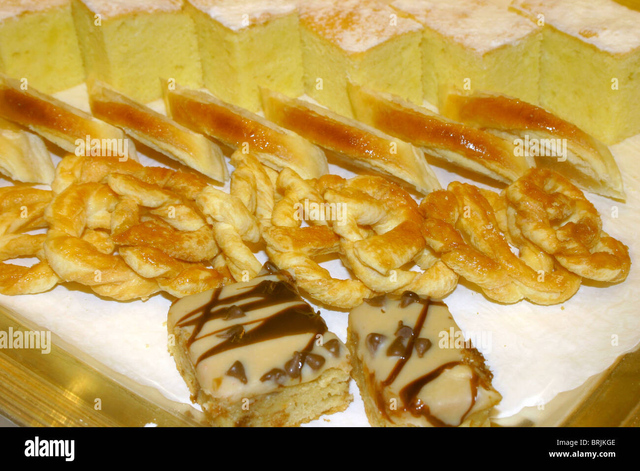 Bite sized pastry deserts on a tray. Stock Photo